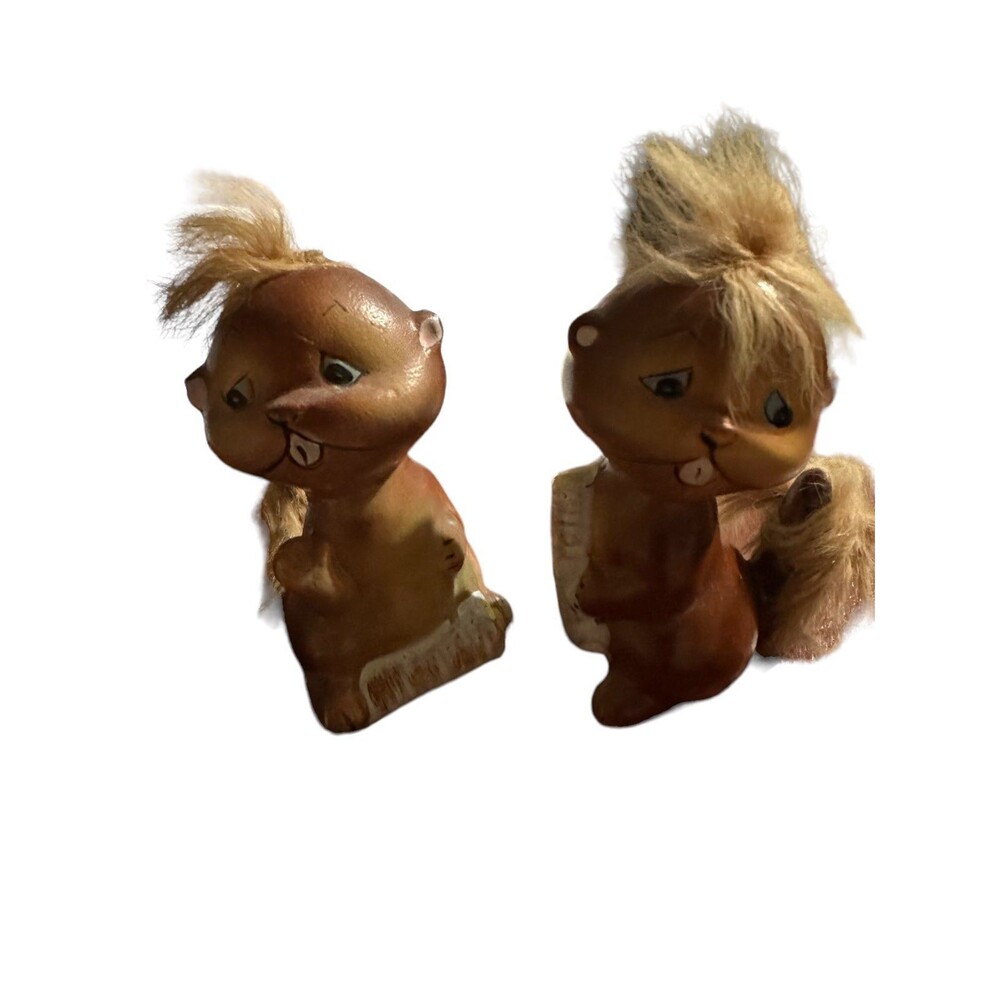 A pair of wood chucks salt and pepper shakers imported from Japan.